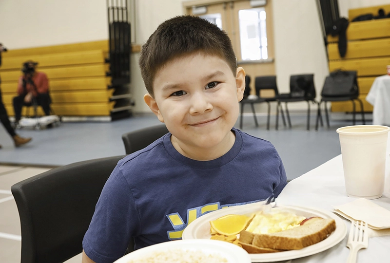 Boy at school breakfast program
